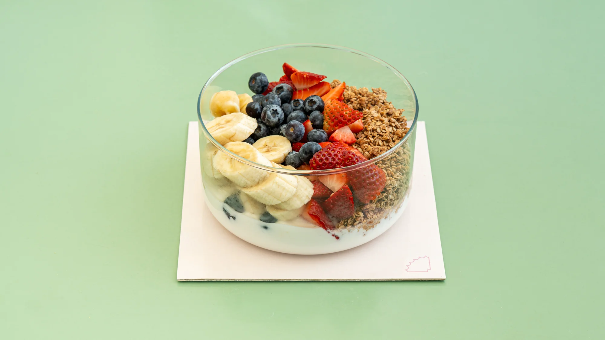 large Greek yogurt bowl with granola and fresh berries