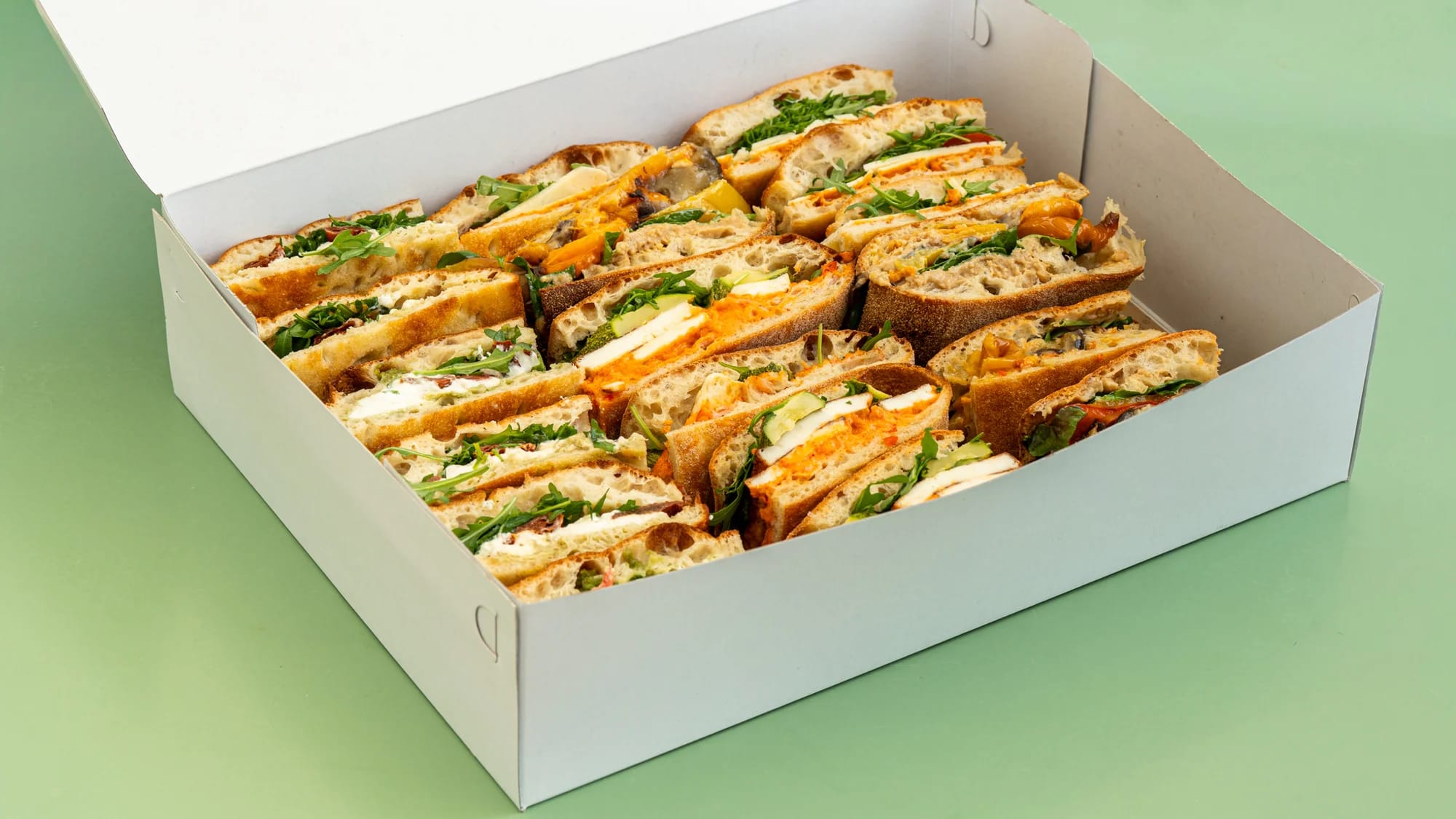 vegetarian and vegan sandwich platter with grilled vegetables and cheeses