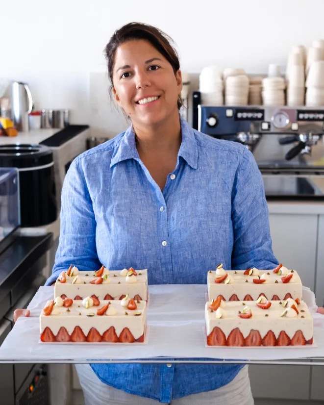 Maria holding desserts